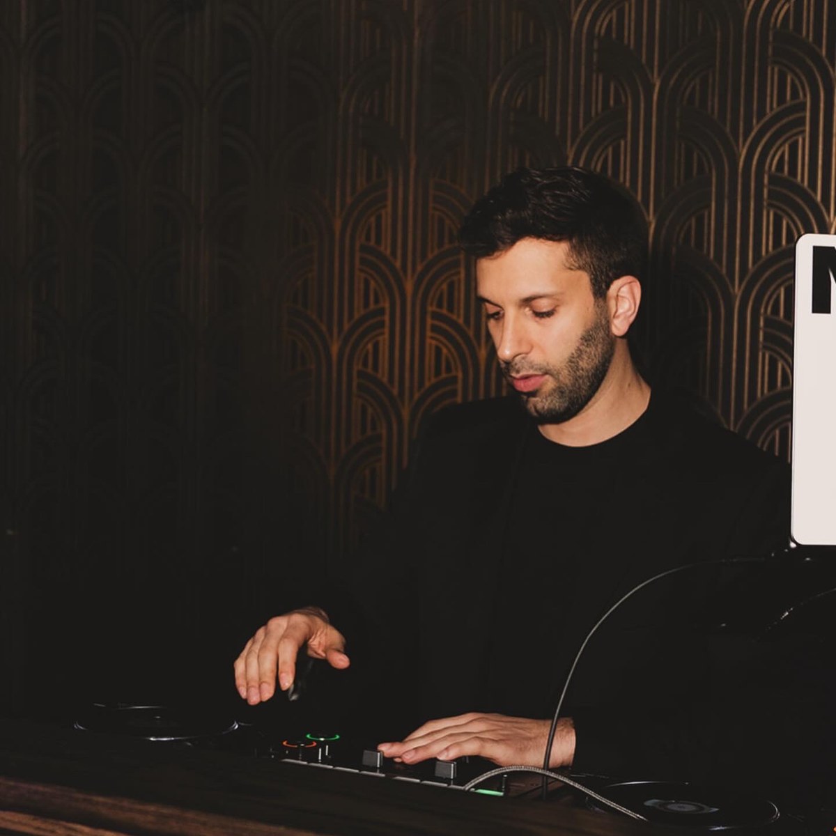 DJ Nugget performing behind the decks